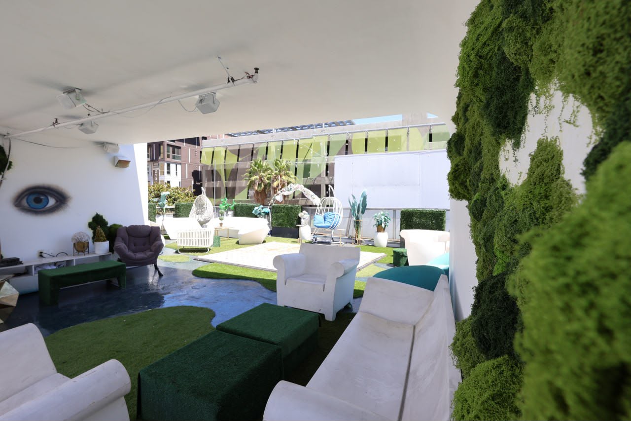 The covered rooftop lounge with its large moss installation